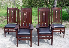 Shown in group of six including two arm chairs. Darker stain.